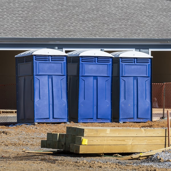 what is the cost difference between standard and deluxe porta potty rentals in Wolf Lake IL